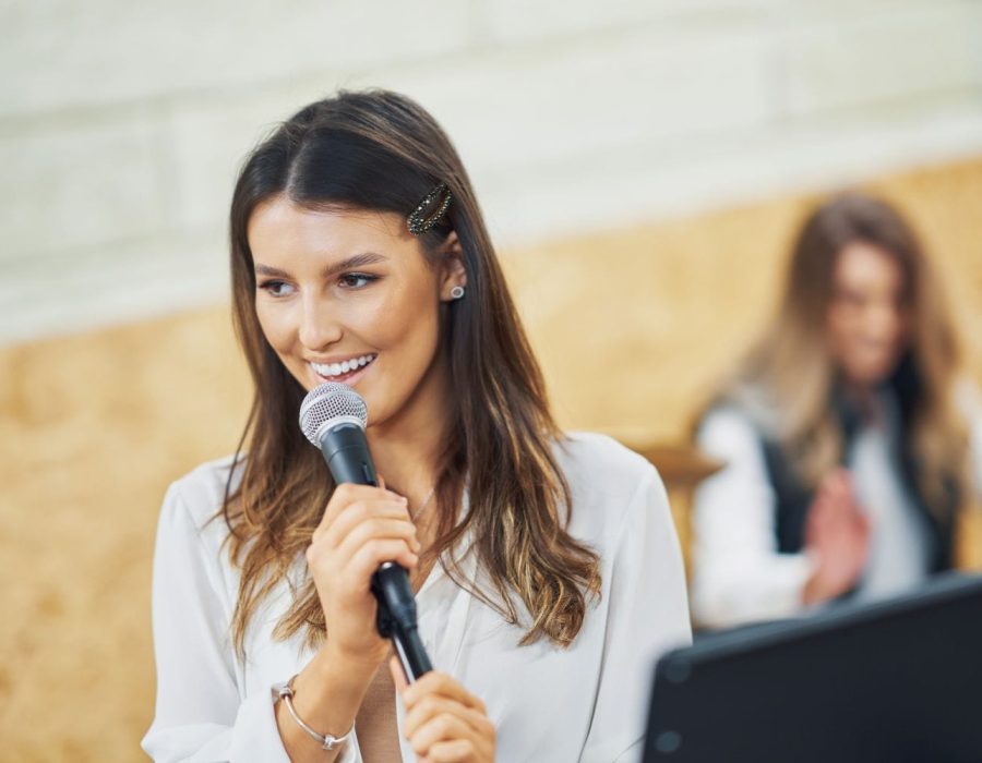 caucasian-woman-singing-into-microphone-in-studio-2025-01-09-01-51-55-utc caucasian-woman-singing-into-microphone-in-studio-2025-01-09-01-51-55-utc